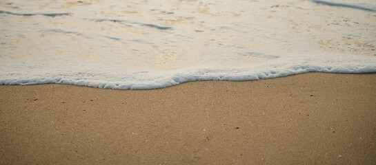 sand and waves on sea for abstract background.