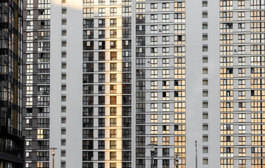 Urban building facade. Seamless pattern of a modern residential structure with rows of identical...