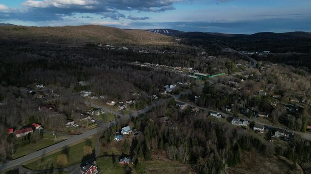 Drone view of Stoneham town from above, under cloudy sky in Canada, Quebec