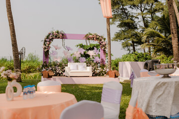 Exquisite flower decoration at an Indian wedding featuring vibrant marigolds, roses, and jasmine,...