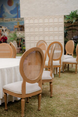Wedding reception, table setting and celebration event with flower arrangement, decor and catering for a romantic setting. Party, luxury restaurant or fancy place with cutlery