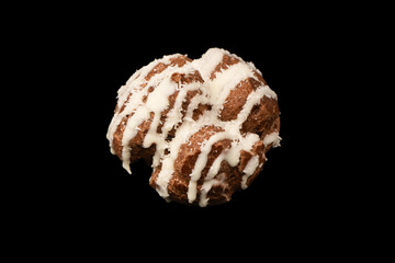 Profiteroles with coconut cream on a black background.