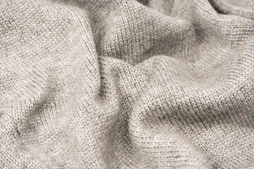 Grey wool sweater texture as a background.