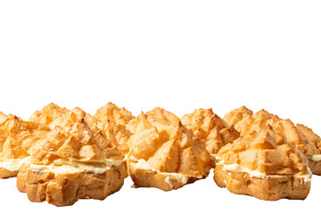 A row of pastries with a white filling. The pastries are arranged in a neat row and are all the same size