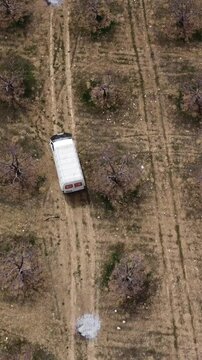 Drone image of moving vehicle in the garden