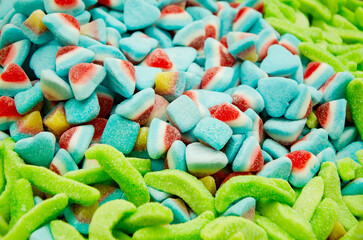 Assortment of delicious colorful gummy chewy candies. Top view. Close-up of colorful jelly candy