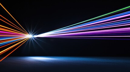 Colorful light beams radiating from a central source in darkness.