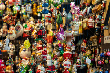 Various glass Christmas ball hand painted ornaments hanging on display at a Munich Christmas market