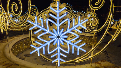 Beautiful glowing Christmas and New year decorations with big abstract snowflakes