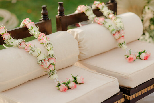 A traditional Indian jaimala ceremony, where the bride and groom exchange floral garlands, symbolizing acceptance and the beginning of their sacred marital journey