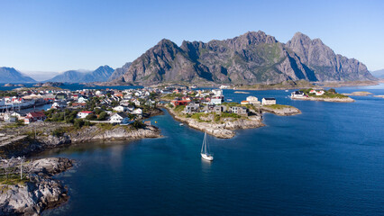 Fototapeta premium Aerial view of Henningsvaer typical norwegian village on a fjordn with in a summer day