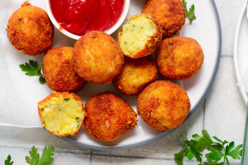 Potato and cheese croquettes with ketchup.top veiw. style rustic