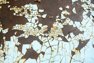 Fototapeta premium The vintage industrial background features a rusty, textured metal sheet with a blend of brown and blue tones, showcasing a rough, grunge pattern on its strong, antique alloy surface, template retro.