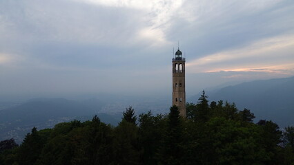 Breathtaking aerial images from the top of the Volta lighthouse on the top of the hill near the city of Como in the light of sunset