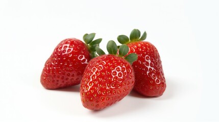 fresh red strawberries arranged on white surface with vibrant color tempting closeup angled composition copyspace concept of healthy eating dessert marketing