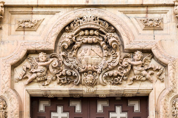 Ornate stone carving on historical building in Salamanca, Spain
