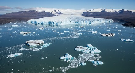 Obraz premium Aerial View of Glacier Lagoon with Icebergs and Snow Capped Mountains