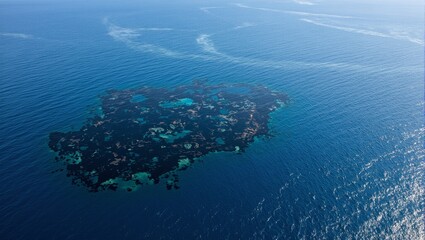 Devastating aerial shot of oil spill in the ocean viscous substance spreading calm waters tainted