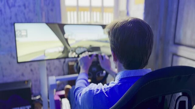 Individual enjoys realistic car racing simulation using advanced technological setup in indoor environment