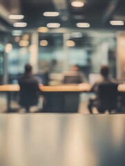 Blurred office interior with people working in the blurred background