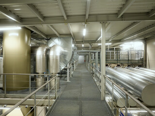 Modern Heating Plant Interior with Steel Pipelines and Advanced Control Systems – Efficient Energy Infrastructure in Industrial Environment.