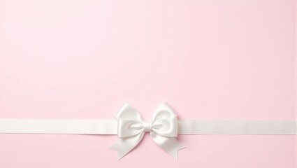Elegant white satin bow on pastel pink background perfect for wedding and anniversary themes