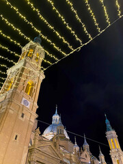 basilica del pilar tower at night with christmas lights