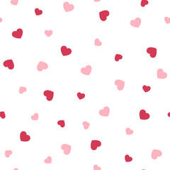 Hearts seamless pattern. Pink and red hearts on a white background. Vector illustration.
