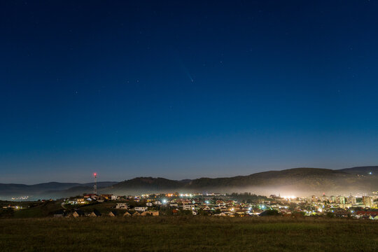 Night Cityscape Lights With The Tsuchinshan&ndash;ATLAS (C2023-A3) Comet On The Sky