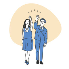 ハイタッチする制服の男女