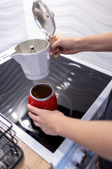 making coffee in a coffee pot on an electric stove, morning coffee in a coffee pot