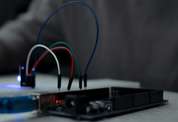 Man Learns Microcontroller Programming Close-Up