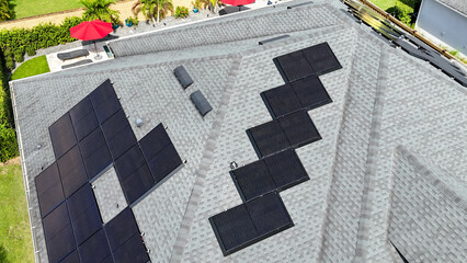 A home with solar panels on the roof in a neighborhood in Orlando, Florida