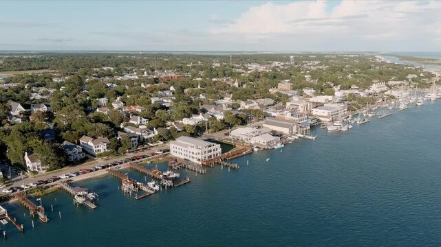 Aerial orbiting drone shot of the downtown area and marina of Beaufort, North Carolina on the Outer Banks.