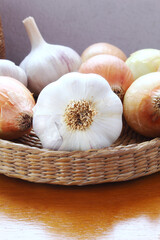 Brazilian seasonings. Garlic and onions in a wicker baskt.