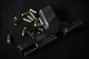 Unloaded semi automatic pistol handgun at home with munition