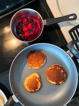 Homemade Pancakes with Berry Sauce on the Stove