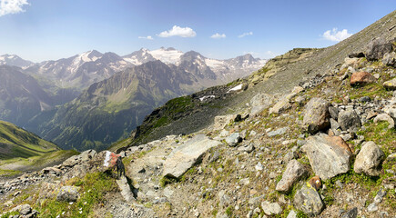 Hiking near Neue Regensburger Hut at Stubai High Trail (Stubaier Höhenweg), one of the most beautiful high-altitude hikes in austrian Alps, near stubai glacier and Innsbruck in summer, Tirol Austria