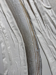 Plaster wall with volumetric relief surface wavy form pattern. Showing remarkable design, beautiful curves and patterns. Gypsum texture panel. Interior decoration, design element. 