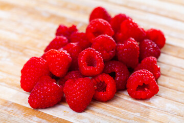 Fresh and tasty looking raspberries on a table