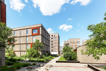 Cityscape of a residential area with modern sustainable apartment buildings, new green urban landscape in the city