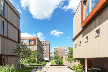 Cityscape of a residential area with modern sustainable apartment buildings, new green urban landscape in the city