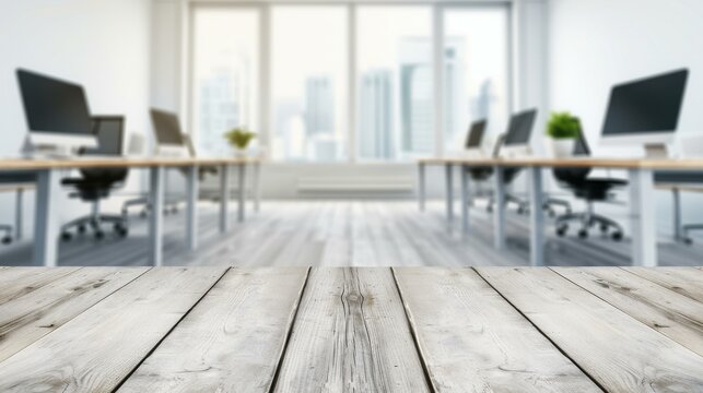 A sleek wooden table sits emptily, framed by a blurred office, embodying the essence of modern workspaces.