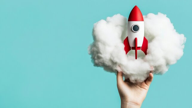 Red Rocket Taking Off from Cloud Held by Hand Innovation Concept