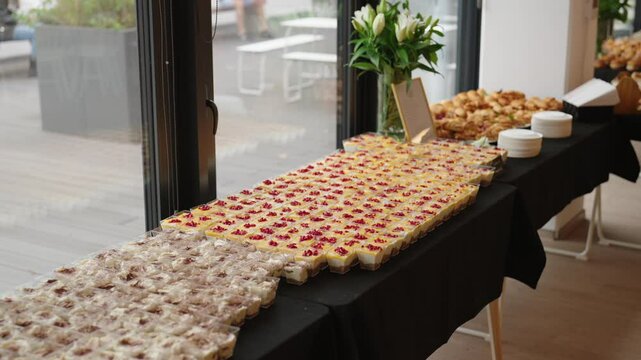 catering desserts, tiramisu, snacks with mango mousse and pomegranate seeds