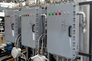Control panels for industrial machinery in manufacturing facility