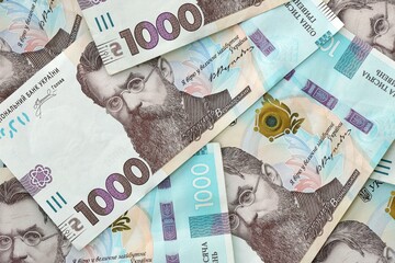 Big amount of ukrainian new one hundred hryvnia money bills with modern design. Financial concept, business
