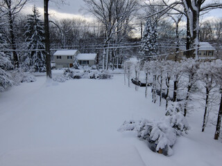 front yard and driveway covered with snow after the snow storm in February in New Jersey 