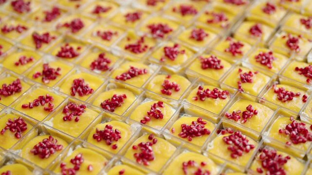 catering desserts with mango mousse and pomegranate seeds