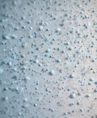 Obraz premium Small blue dots scattered across a digital background with pastel hues, digital landscape, blue dots